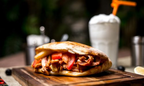 close-up-chicken-doner-with-tomato-french-fries-served-with-ayran_141793-2022